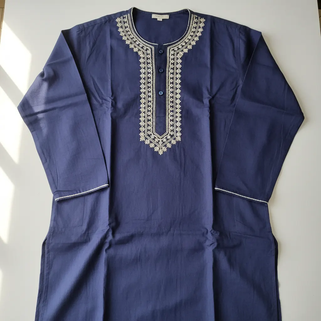 Flat-lay kurta on plain background